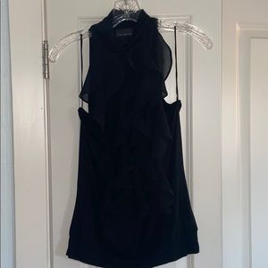 Ruffle detail turtleneck sleeveless blouse
